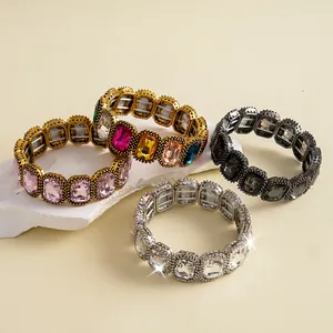 Detailed view of four vintage square rhinestone elastic bracelets in various colors