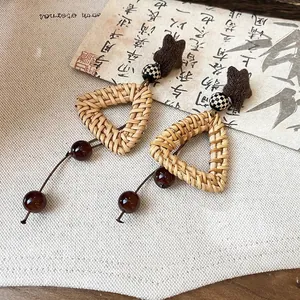 Handmade Bohemian ethnic style woven triangle earrings with brown star and beads