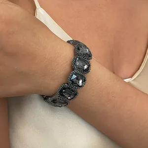 Close-up of a vintage black geometric crystal elastic bracelet on a woman's wrist
