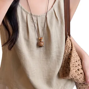 Handcrafted vintage wooden bear pendant necklace with brown leather cord for ethnic style