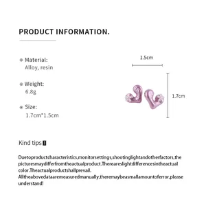 Detailed product information for pink resin heart earrings showing material and size