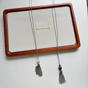 Long stainless steel tassel necklace with beads detail and retro sweater chain design
