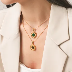 Detail of vintage gold sunflower pendant necklaces with natural stones on a model