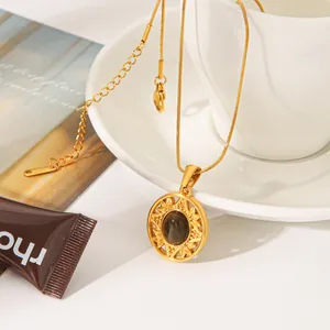 Detailed view of a vintage sunflower medallion necklace with a natural stone pendant