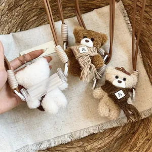 Cute plush teddy bear pendant necklace with phone holder accessory in warm autumn tones