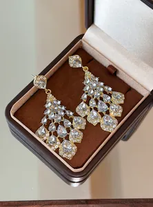 Detailed view of vintage palace style chandelier earrings with clear waterdrop rhinestones