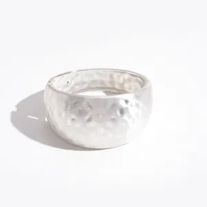 Elegant silver metal hammered wide cuff bangle with geometric textured finish for women
