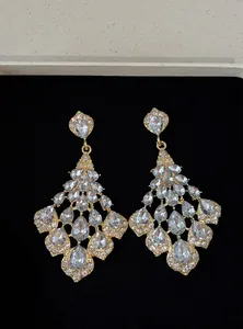 Detailed macro view of vintage court-style teardrop crystal chandelier earrings