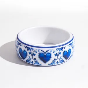 Elegant blue and white porcelain style resin bangle with printed heart and vine patterns