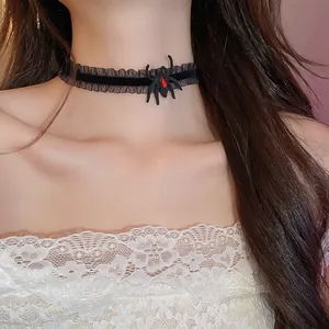 Detailed view of Halloween dark spider choker necklace featuring a red gem on neck