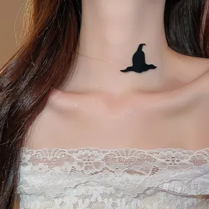 Close-up of black witch hat pendant on invisible fishing line choker for Halloween party.