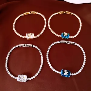 Detailed view of 18k gold and silver plated tennis bracelets with butterfly square zircon
