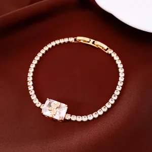 Macro view of 18k gold plated bracelet with square zirconia and butterfly detail
