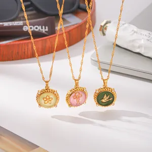 Detailed view of three gold titanium steel round necklaces with colorful oil-drop pendants