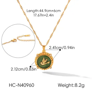 Detailed size and weight parameters of a gold-toned bird pendant necklace with green enamel