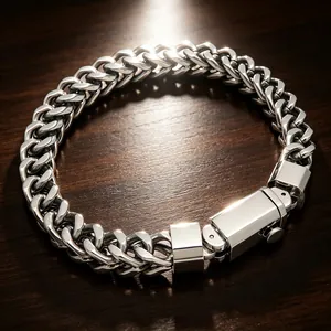 Close-up of stainless steel Franco link bracelet with square press clasp on wood