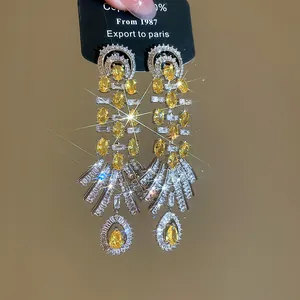 Detailed close-up of luxury 18k gold plated vintage water drop zircon pendant earrings