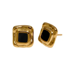 Vintage 18K vergulde geometrische oorknopjes met zwart emaille voor dames.