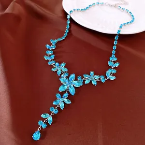 Exquisite detailed view of a sky blue zircon floral necklace with water drop pendant
