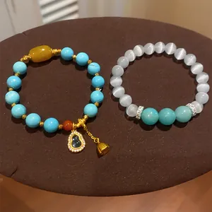 Handcrafted resin beaded bracelet set with sparkling gourd and lotus charms.