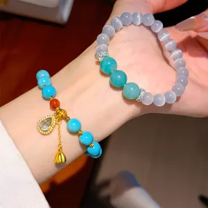 Detailed view of elegant New Chinese style beaded bracelets with golden gourd charm.