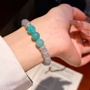 Macro view of elegant resin beaded bracelet with sparkling zirconia spacers on wrist