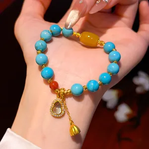 Exquisite handmade turquoise resin bead bracelet with a crystal golden gourd pendant