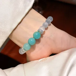 Close-up of resin beaded bracelet with turquoise stones and shimmering zircon spacers
