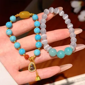 Close-up of New Chinese style beaded bracelets with zircon gourd pendant and cat eye stones