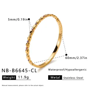 Detailed dimensions of the geometric zirconia stainless steel bangle with weight information.
