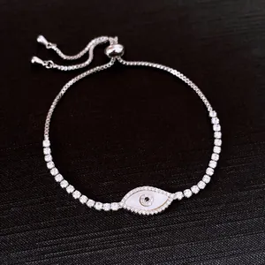 Detailed macro view of an elegant zircon shell evil eye drawstring bracelet for women