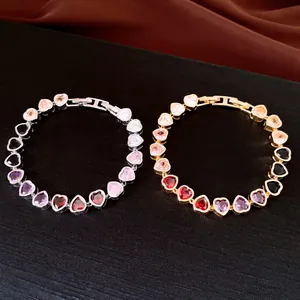 Detail of 18k gold and silver plated heart-shaped zircon bracelets in various colors.