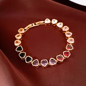 Detail view of 18k gold-plated bracelet with multi-colored heart-shaped zircon stones.