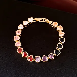 Detail view of heart-shaped zircon bracelet with 18k gold plating and secure folding clasp