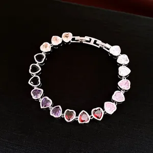 Detail showing multi-colored heart-shaped zircon bracelet with high-shine finish