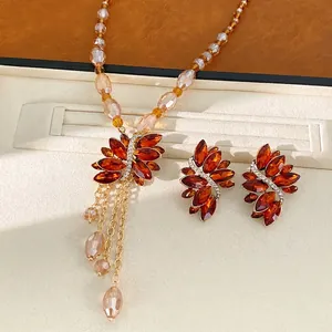 Parure vintage collier et boucles d'oreilles en perles ambre avec strass et glands