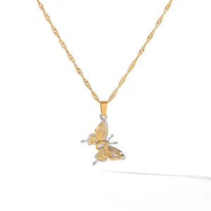 Detailed view of a two-tone stainless steel butterfly pendant with a zircon stone