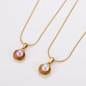 Detailed macro view of stainless steel shell pendants with elegant pink and white pearls