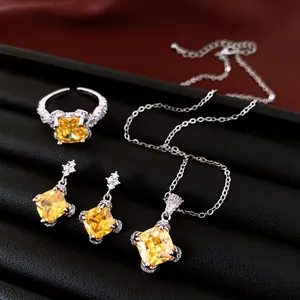 Vintage yellow zircon geometric jewelry set featuring necklace, ring, and earrings
