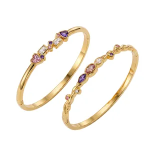 Gold stainless steel bangles featuring colorful heart and geometric zircons stones