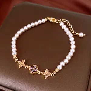 Exquisite detail of French style pearl bracelet with sparkling zircon flower charms