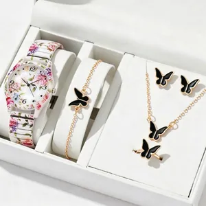 Detailed view of floral print quartz watch with matching black butterfly jewelry set in a gift box