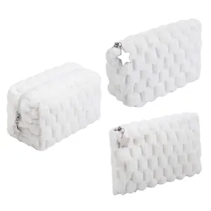Set of white plush checkered cosmetic bags with star charm pendants for travel storage.