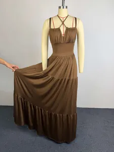 Elegant brown tiered maxi dress with pleated bodice and spaghetti straps detail view