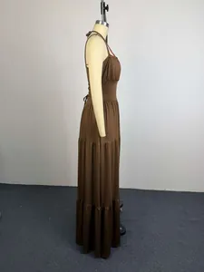 Side view of an elegant brown pleated high waist maxi dress displayed on a mannequin.