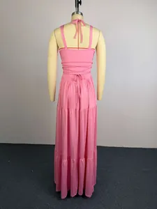 Detailed back view of an elegant pink pleated high-waisted maxi dress with lace-up strappy design.