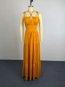 Full length view of a mustard yellow pleated high-waisted maxi dress on a mannequin