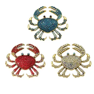 Set of three luxury rhinestone crab brooches in vibrant blue, red and silver crystal