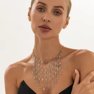 Detailed view of elegant gold multi-layered fringe necklace with crystals on model