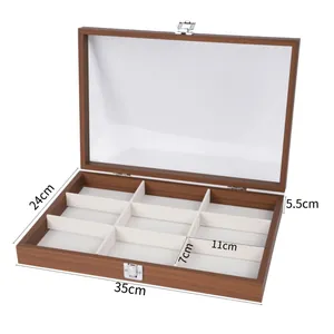 Dimensiones detalladas de un joyero de madera con 8 compartimentos y tapa transparente.